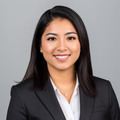 Portrait-style headshot of a woman in business attire with a confident gaze.