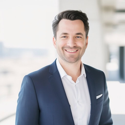 Bright and natural light headshot of a man in business attire, an example of how to take a headshot at home.